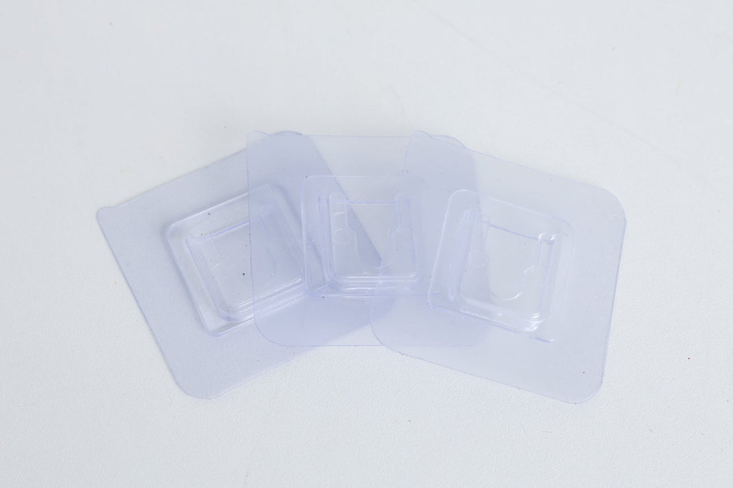 Branch holder -clear adhesive pads that sticks to the white PVC sides